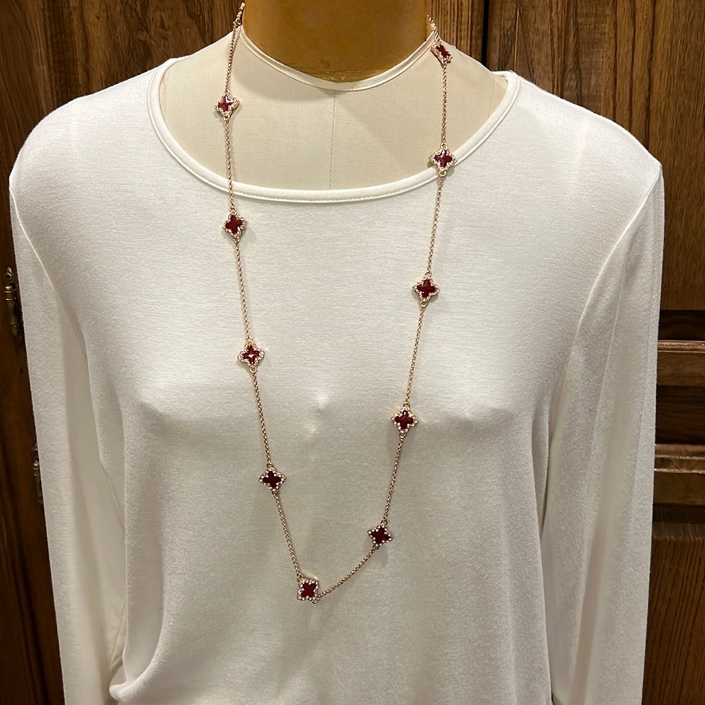 NWOT Gold necklace with burgundy stones and clear rhinestones.